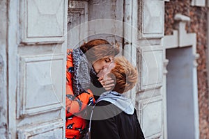 Young couple in love, hugging in the old part of town