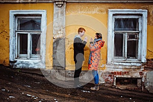 Young couple in love, hugging in the old part of town