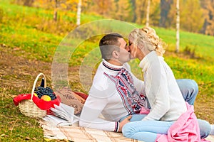 Young couple in love kissing on a picnic