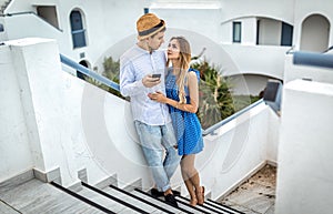 A young couple in love look into each other`s eyes Cyprus, Athens, Greece, Italy, Thira