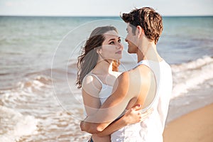 Young couple in love looking at each other and hugging