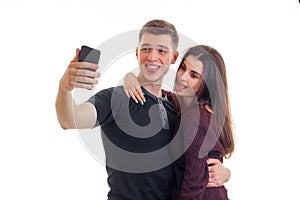 Young couple in love makes selfi and smiles