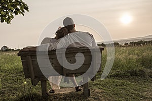 Young couple in love outdoor at the sunset