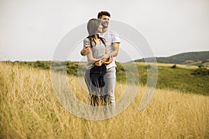 Young couple in love outside in spring nature