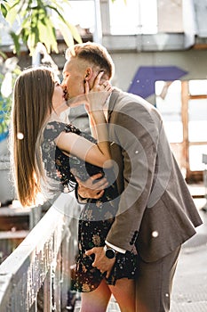 Young couple in love posing on camera