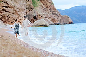 A Young Couple Love Resting on the Beach Smiling Stock Picture