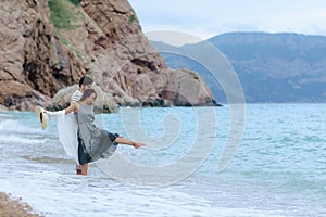 A Young Couple Love Resting on the Beach Smiling Stock Picture