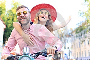 Young couple in love riding a motorbike. Riders enjoying themselves on trip. Adventure and vacations concept