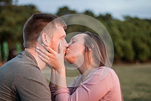 Young couple in love sharing a kiss at the beach