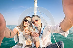 Young couple in love taking selfie on sailing boat