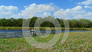 Young couple love walk in boat on lake