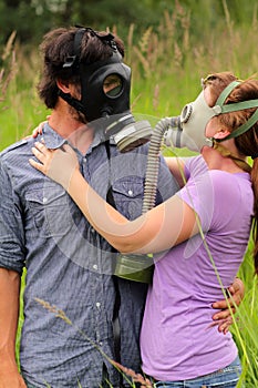 Young Couple in Love Wearing Gas Masks