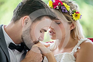 young couple in love Wedding Bride and groom kissing hand in the park. Newlyweds. Closeup portrait of a beautiful having a