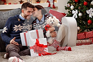 Young couple with white Meltzer as Christmas gift