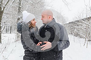 Young couple in love in the winter looking at each other