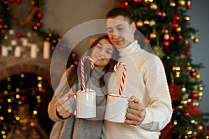 Young couple of lovers celebrates the New Year holiday at home