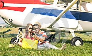 Young couple of lovers having a rest during charter airplane excursion - Wanderlust concept of alternative people lifestyle