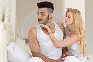 Young Couple Lying In Bed, Having Conflict Problem, Sad Negative Emotions Unhappy Hispanic Man And Woman