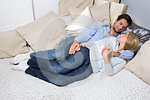 Young Couple lying On A Couch