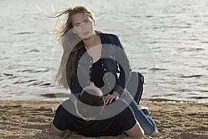 Young couple lying on the sandy beach