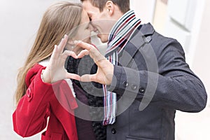 Young Couple Making Heart Shape With Hands. Love and Valentines