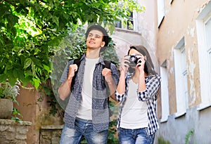 Young couple making photos as tourists