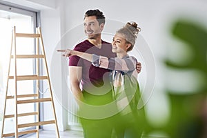 Young couple making plans for home improvement