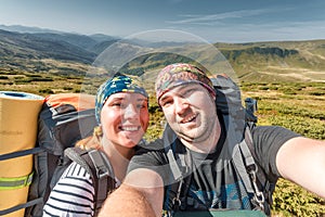 Young couple making selfie snow resort mountain