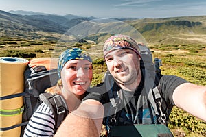 Young couple making selfie snow resort mountain