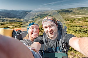 Young couple making selfie snow resort mountain