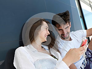 Young couple making selfie together at home