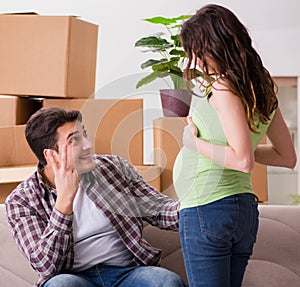 Young couple of man and pregnant wife expecting baby