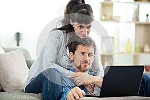 young couple managing accounts home