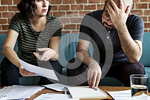 Young couple managing the debt statement