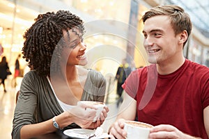 Young Couple Meeting On Date In Cafe photo