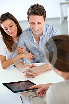 Young couple meeting financial adviser