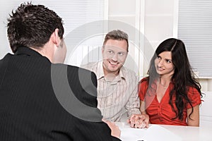 Young couple in meeting - insurance or bank for investments