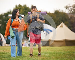 Young Couple Meeting At Summer Music Festival With Camping Equipment