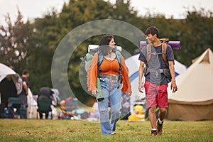 Young Couple Meeting At Summer Music Festival With Camping Equipment