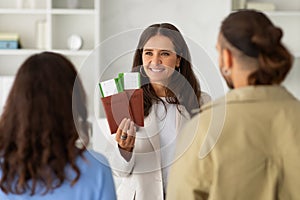 Young couple meeting with a travel agent or visa manager