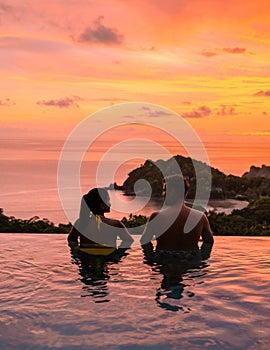 a young couple of men and women at a swimming pool during sunset on a tropical island