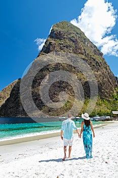 Young couple men and women vacation Saint Lucia, luxury holiday Saint Lucia Caribbean, Sugar beach