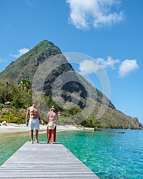 Young couple men and women vacation Saint Lucia, luxury holiday Saint Lucia Caribbean, Sugar beach