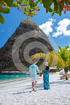 Young couple men and women vacation Saint Lucia, luxury holiday Saint Lucia Caribbean, Sugar beach