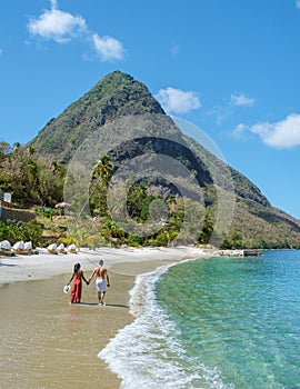 Young couple men and women vacation Saint Lucia, luxury holiday Saint Lucia Caribbean, Sugar beach