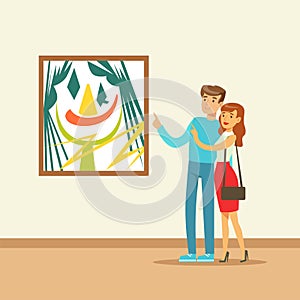 Young couple in modern art gallery looking at the colorful painting