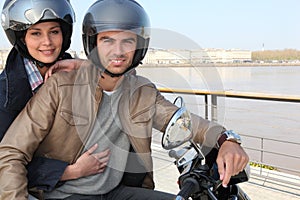 Young couple on a moped