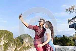 Young Couple Mountain View Point Happy Smiling Man And Woman Taking Selfie Photo On Cell Smart Phone Asian Holiday