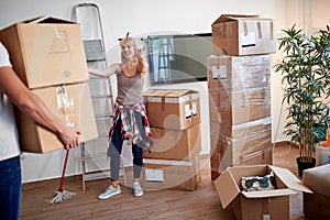 Young couple moving  in new apartmen.  new apartment, new beginning, joy, moving in  concept