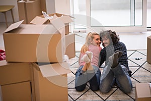 Young couple moving in a new flat